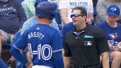 Chris Bassitt talks to an umpire