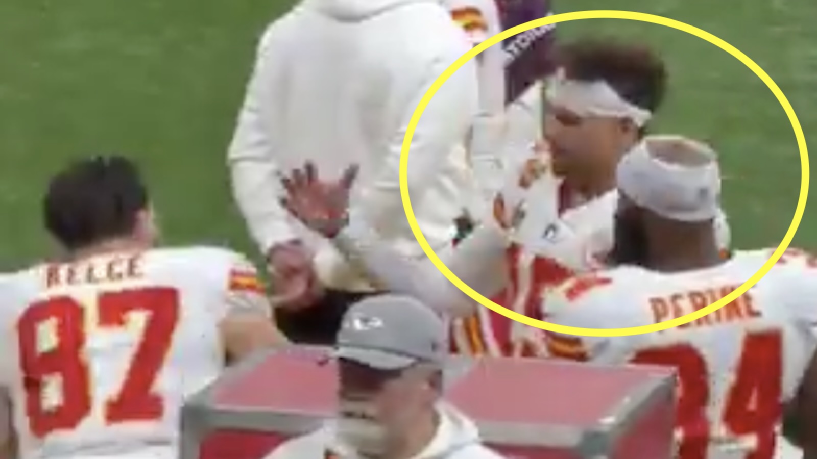 Patrick Mahomes high fives teammates on the sideline
