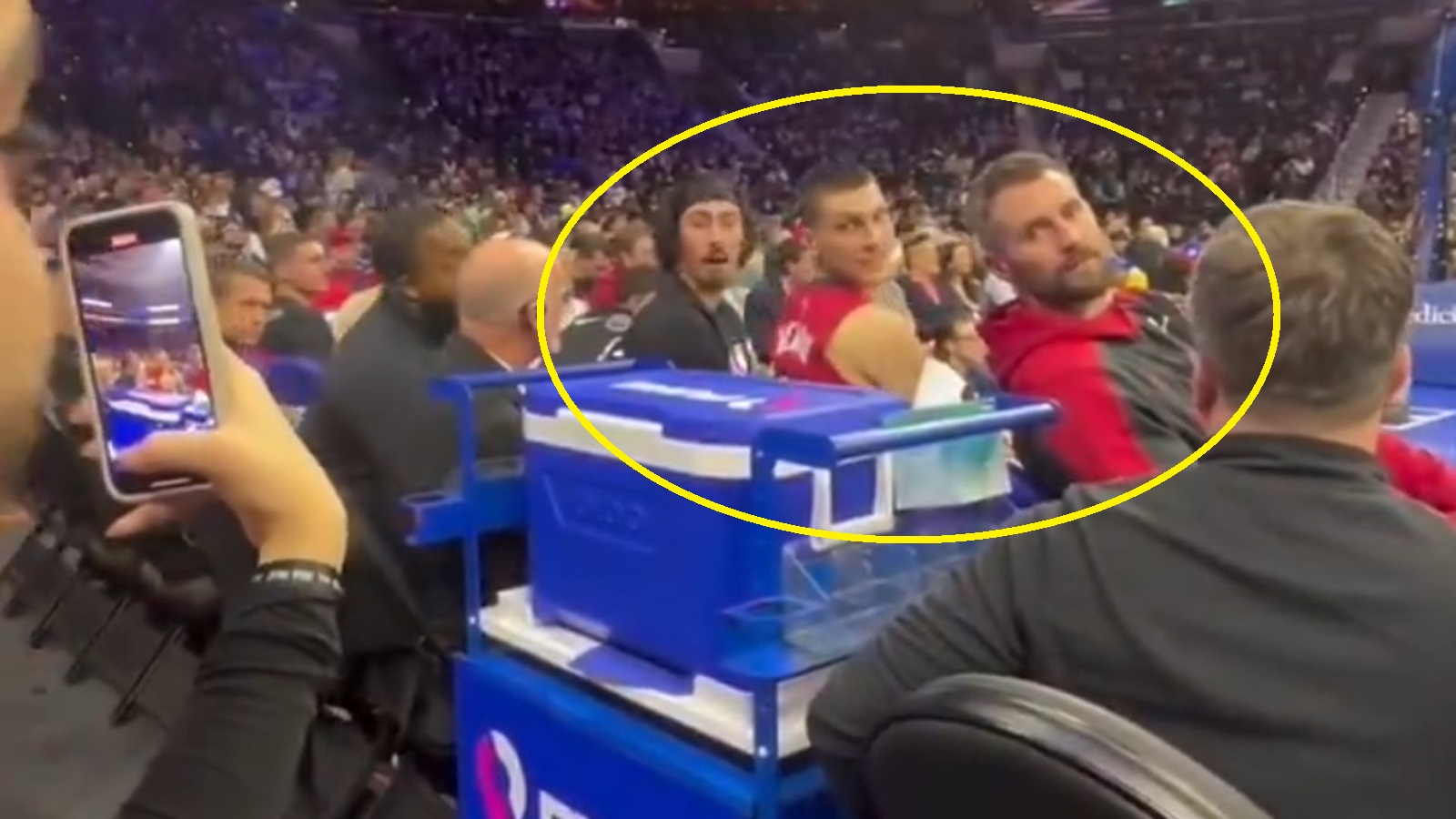 Miami Heat players looking back from the bench