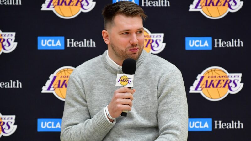 Luka Doncic holds a microphone