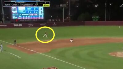 Florida State shortstop Alex Lodise throws to first