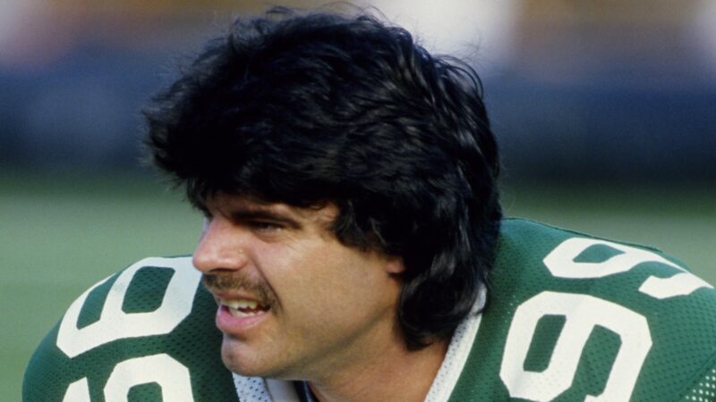Mark Gastineau looks on