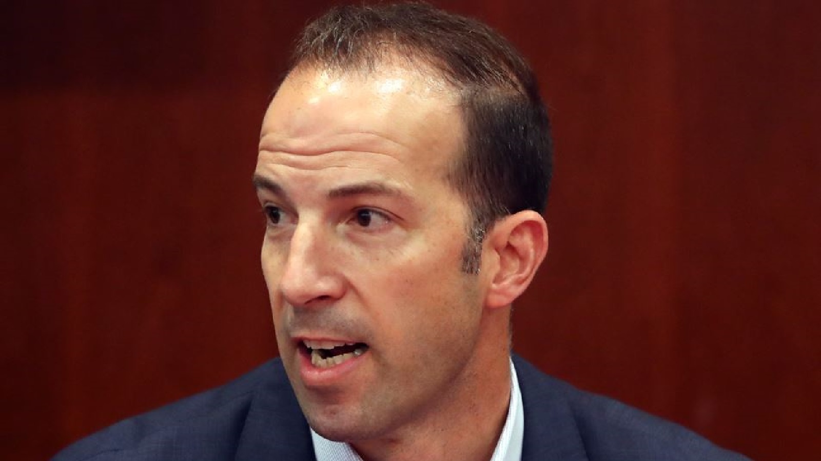 Billy Eppler looking on