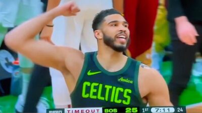 Jayson Tatum holds his hand up