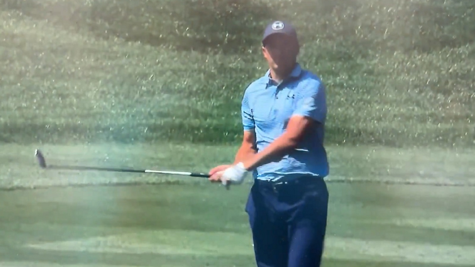 Jordan Spieth holds his club