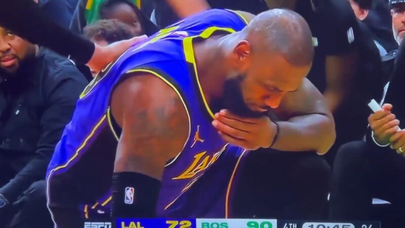 LeBron James hunched over in pain