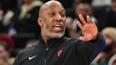 Chauncey Billups motions from the sideline