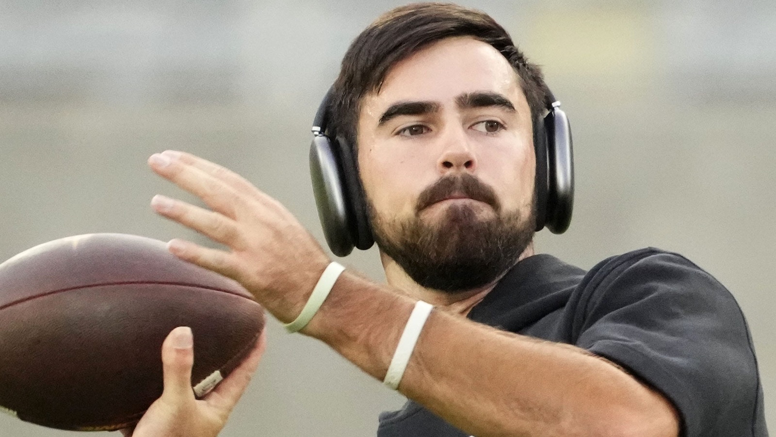 Drew Pyne throws a pass
