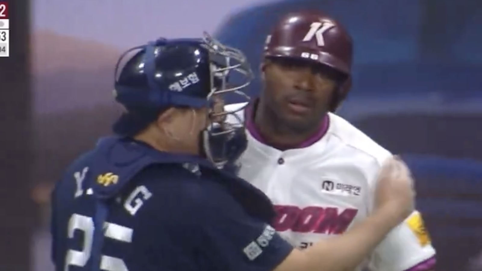Yasiel Puig is held back from charging the mound