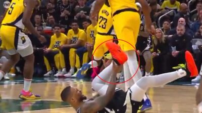 Damian Lillard grabs his ankle