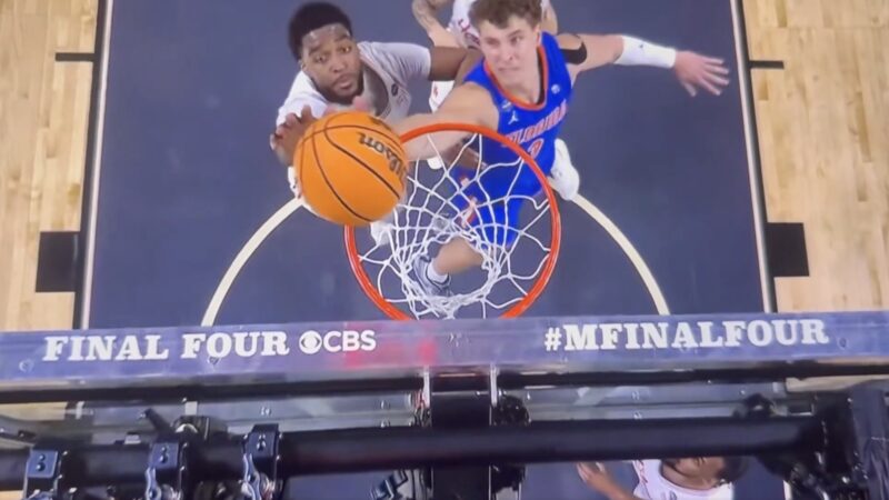 Houston and Florida players battling for a rebound in the NCAA championship game