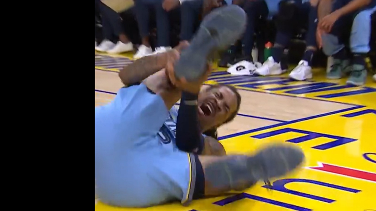 Ja Morant grabs his ankle