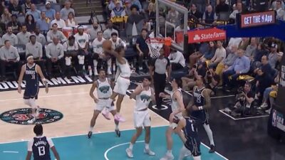 Grizzlies star Ja Morant goes up for a putback dunk against the Mavericks