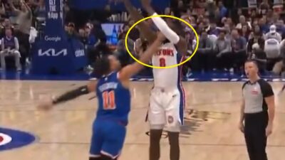 Jalen Brunson poking an opponent in the eye