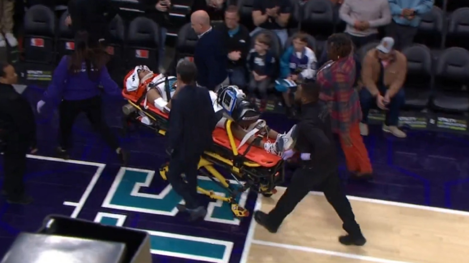 Jaylen Wells on a stretcher