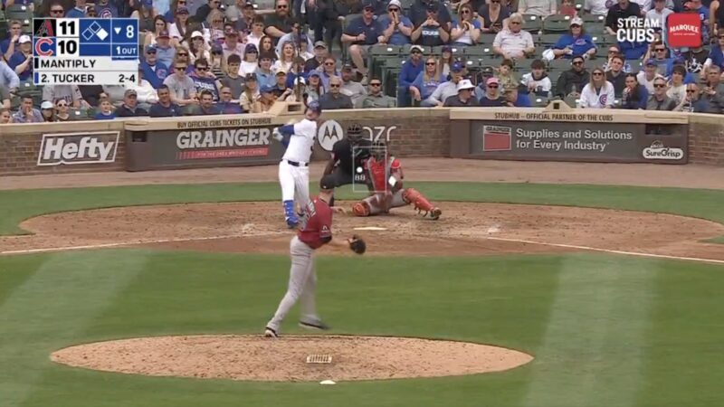 Cubs slugger Kyle Tucker hitting a home run against the Diamondbacks