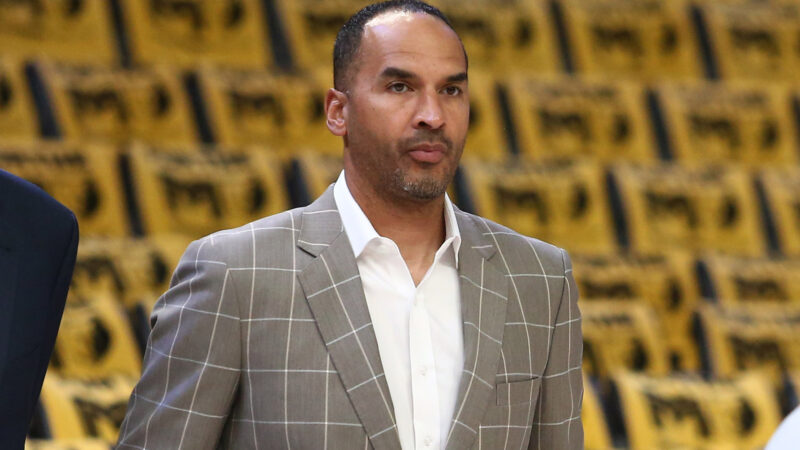 Mavericks GM Nico Harrison in a suit