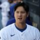 Shohei Ohtani in a Dodgers jersey in the dugout
