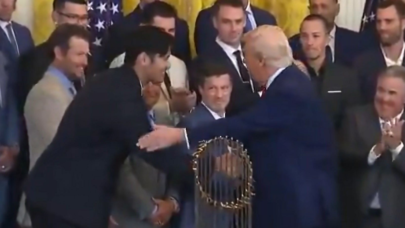 Shohei Ohtani shaking hands with Donald Trump