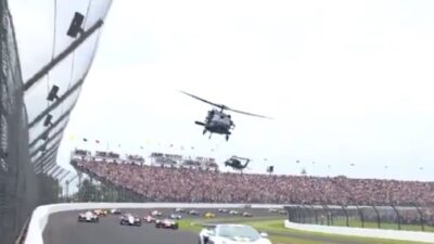 Helicopters fly over the Indy 500 as a tribute to the US Army