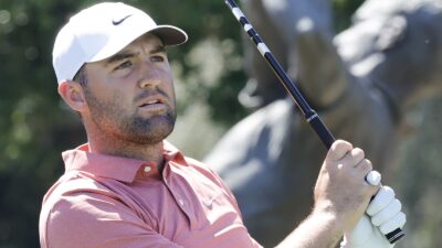 Scottie Scheffler swings a club