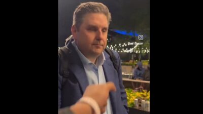 Brian Windhorst being confronted by a fan