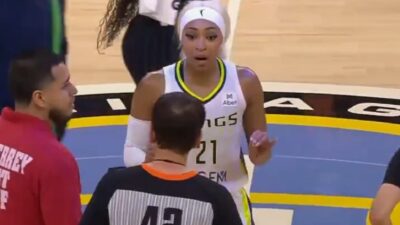 Dijonai Carrington talks to a referee