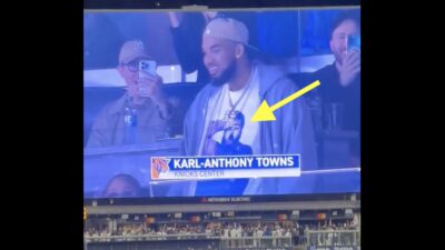 Karl-Anthony Towns wearing a shirt with a Knicks fan printed on it