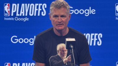 Steve Kerr wearing a Gregg Popovich shirt
