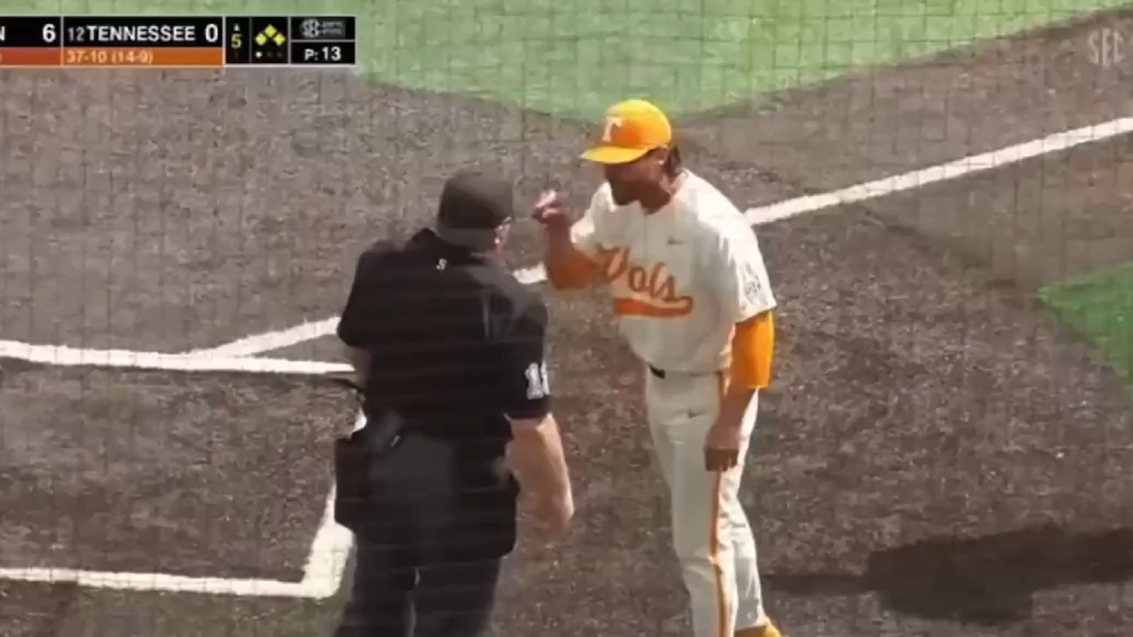 Tony Vitello points at an umpire