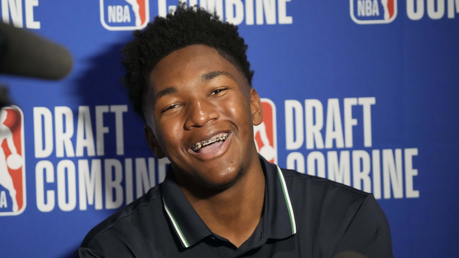 Derik Queen smiles during an interview