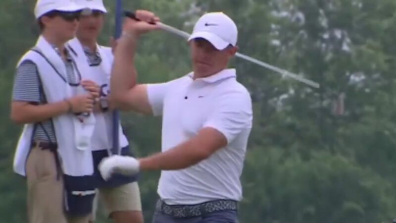 Rory McIlroy throws a club