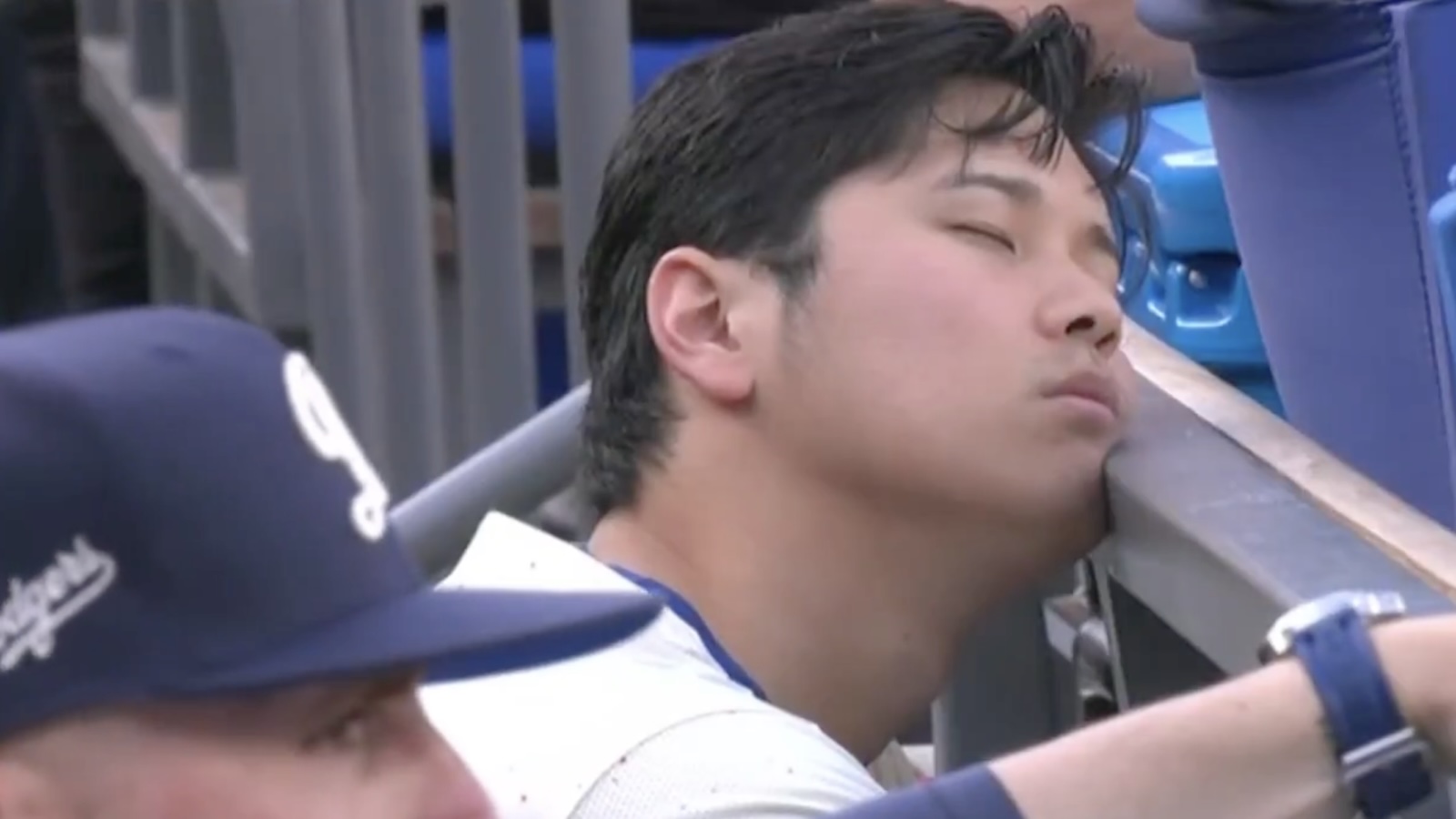 Shohei Ohtani sleeping in the dugout