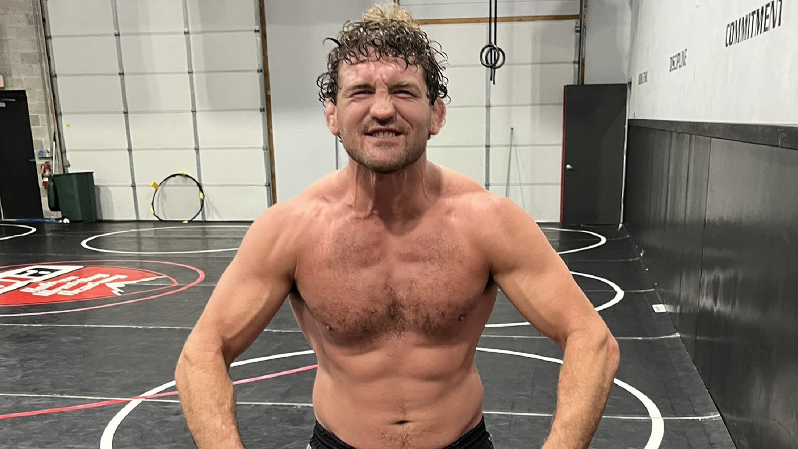 Ben Askren smiles and flexes