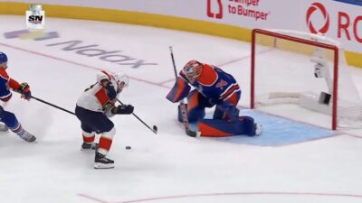 Panthers winger Brad Marchand scores a goal against Oilers goalie Stuart Skinner