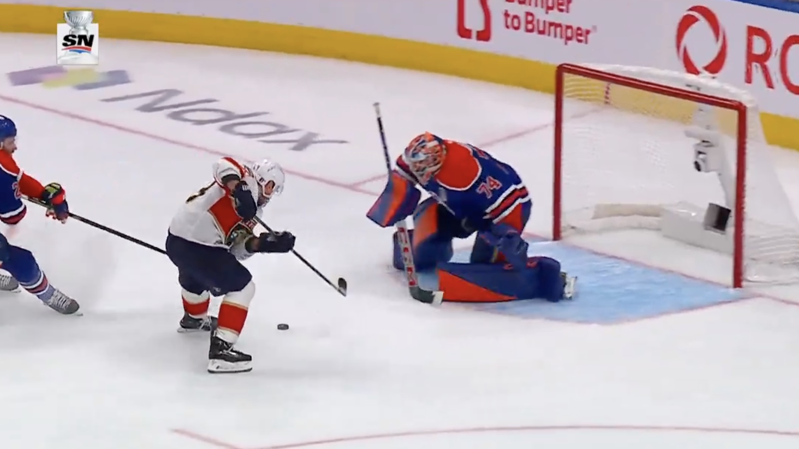 Panthers winger Brad Marchand scores a goal against Oilers goalie Stuart Skinner
