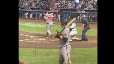 Hunter Bigge being struck by a foul ball into the dugout