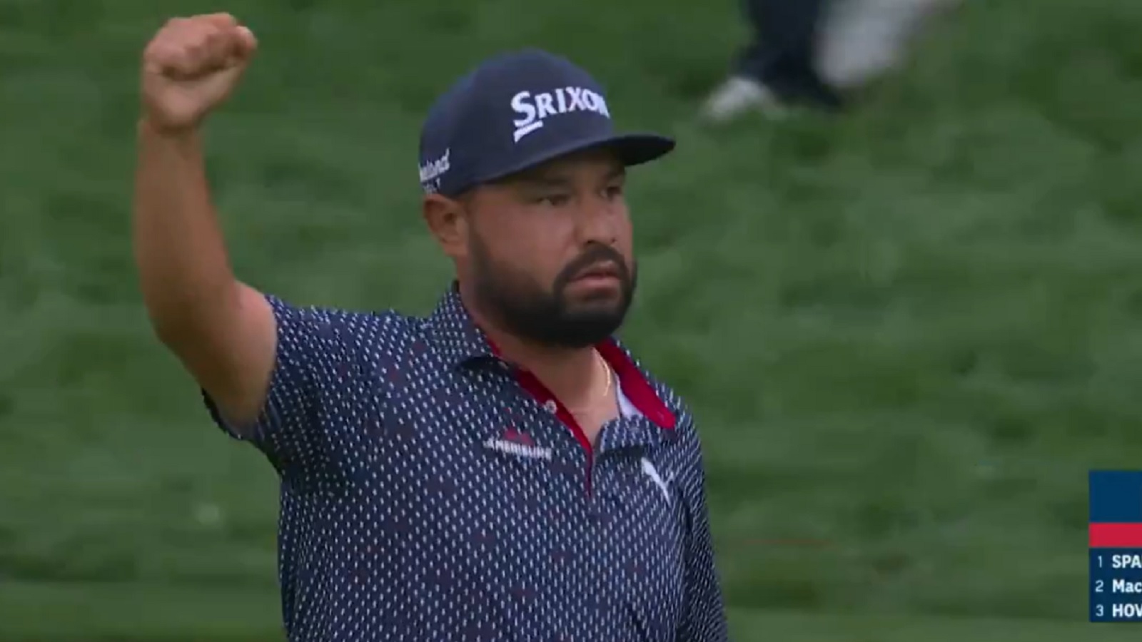 JJ Spaun raises his arm