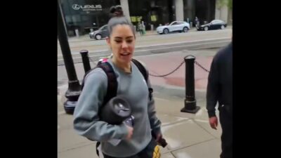 Kelsey Plum standing outside of her team hotel