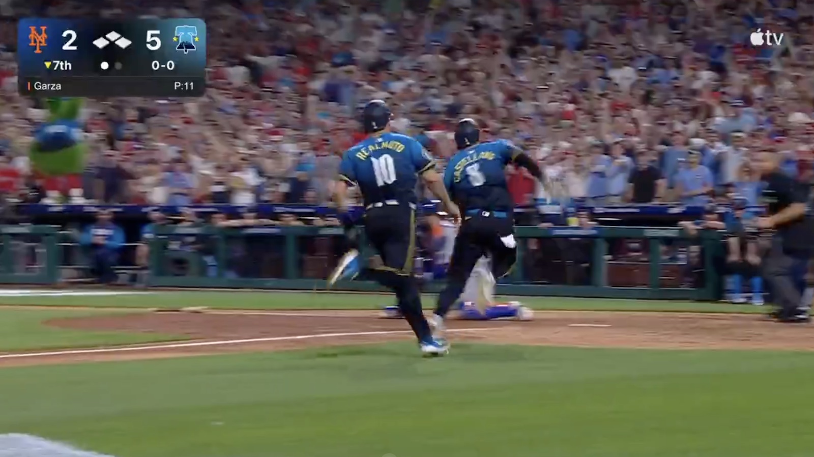 Two Phillies players running for home plate