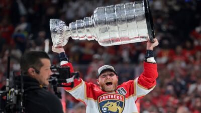 Sam Bennett holds up the Stanley Cup