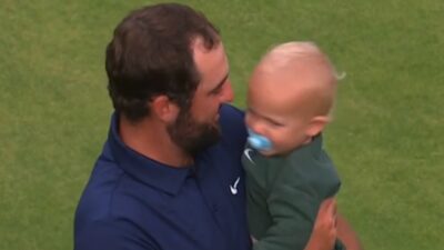 Scottie Scheffler holds his son Bennett