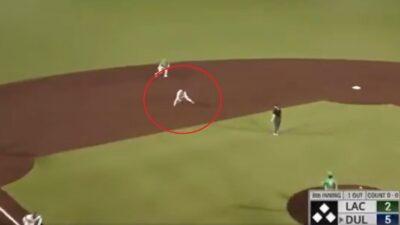 A runner fields a ball