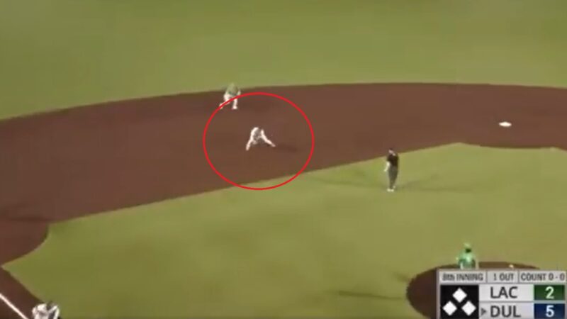 A runner fields a ball