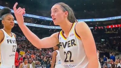Caitlin Clark holds out her finger