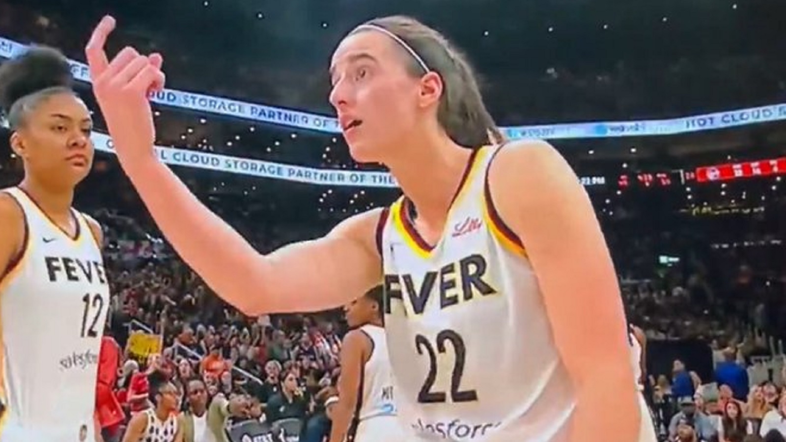 Caitlin Clark holds out her finger