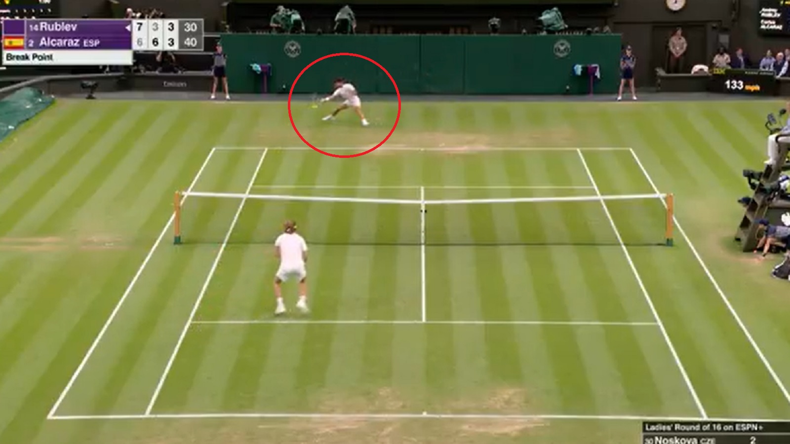 Carlos Alcaraz reaches for a ball