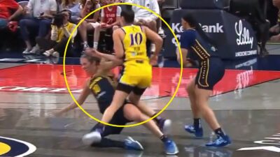 Kelsey Plum stepping over Lexie Hull