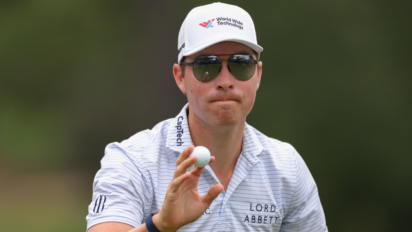 Ben Griffin waves to the gallery