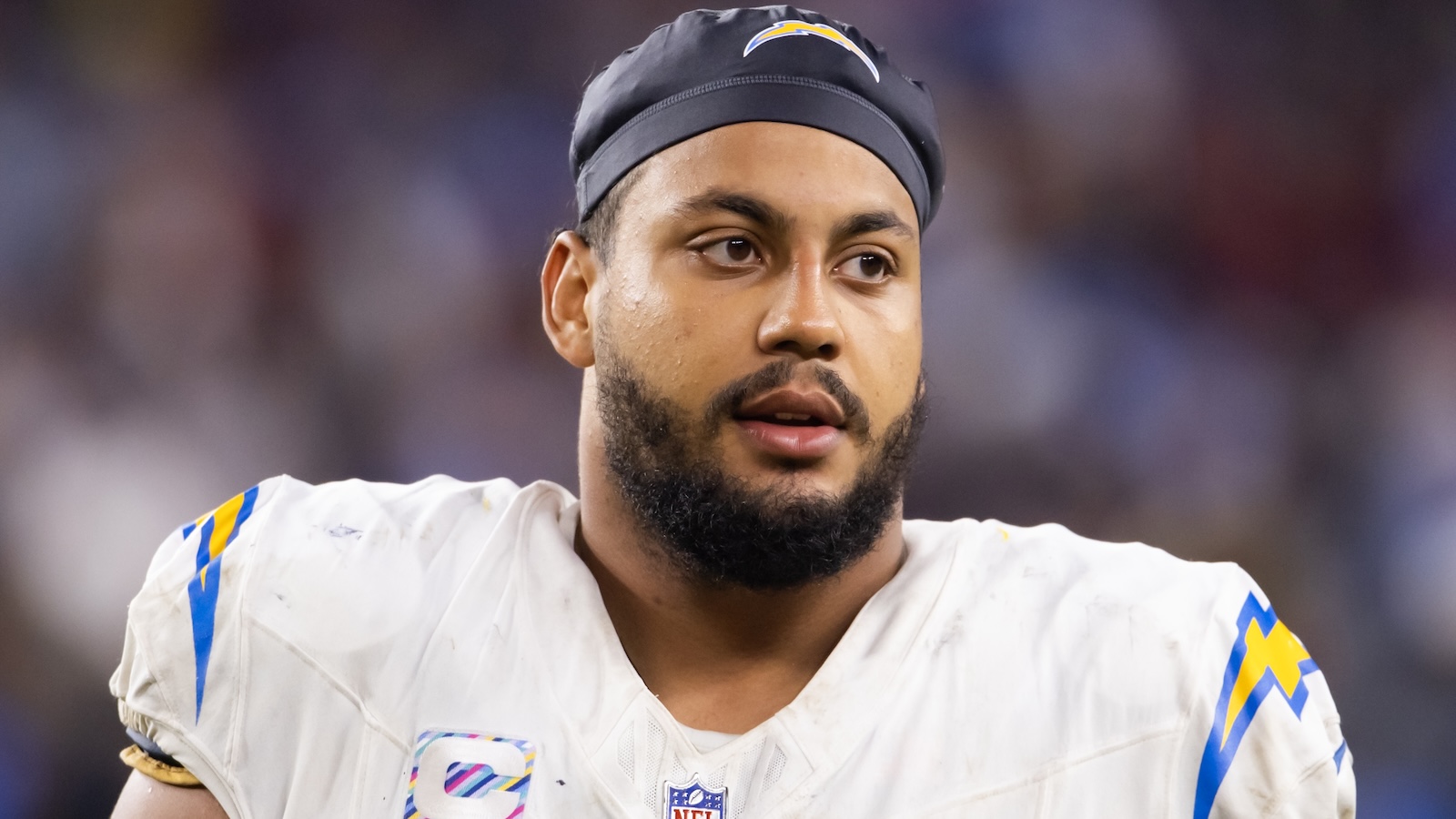 Rashawn Slater looks on